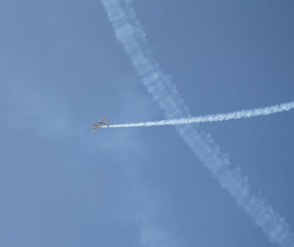 John Collver soars above the flight line in an AT-6 Texan “War Dog” during his performance at the 2018 MCAS Miramar Air Show aboard Marine Corps Air Station Miramar, Calif., Sept. 28. This year’s air show honors “100 years of women in the Marine Corps” by featuring several performances and displays that highlight accomplishments and milestones women since the first female enlistee, Opha May Johnson, who joined the service in 1918. (U.S. Marine Corps photo by LCpl Raynaldo D. Ramos)