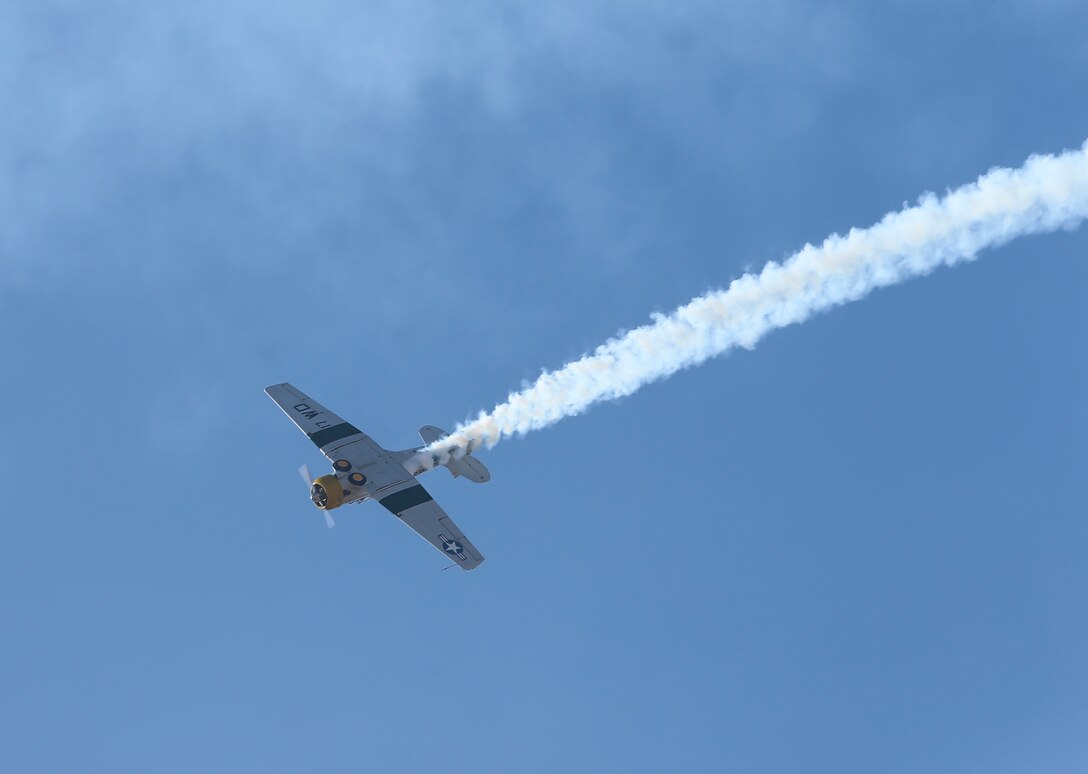 John A. Collver performs aerial maneuvers during the 2018 Marine Corps Air Station Miramar Airshow in a World War II-era AT-6 trainer at Marine Corps Air Station Miramar, Calif., Sept. 28. This year’s air show honors “100 years of women in the Marine Corps” by featuring several performances and displays that highlight accomplishments and milestones women made since the first female enlistee, Opha May Johnson, who joined the service in 1918. (U.S. Marine Corps photo by Cpl. Nadia J. Stark/Released.)