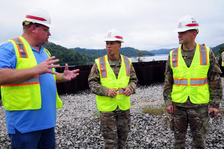 Bill DeBruyn (left) Center Hill Dam Safety Rehabilitation Project resident engineer, briefs Maj. Gen. Mark Toy (center), Great Lakes and Ohio River Division commander, and Lt. Col. Cullen Jones, Nashville District commander, on the progress and construction of the roller compacted concrete berm at the saddle dam in Silver Point, Tenn., Sept. 26, 2018. The saddle dam is nearby Center Hill Dam. (USACE Photo by Mark Rankin)