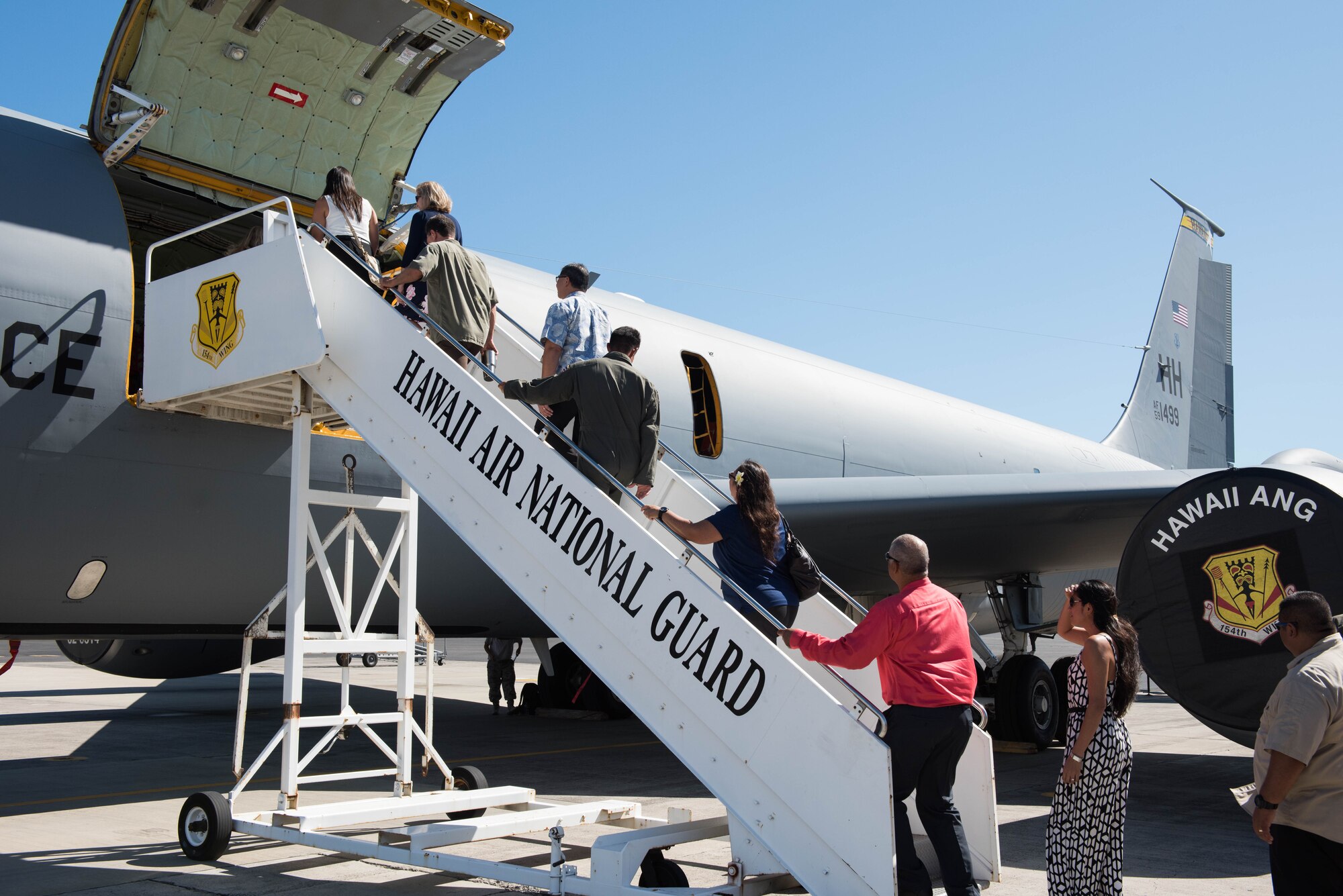 A group from the Commonwealth of the Northern Mariana Islands, the Commonwealth Port Authority, and Department of Defense civilians, contractors and service members take a tour of a KC-135R Stratotanker on Joint Base Pearl Harbor-Hickam, Hawaii, Sept. 19, 2018.
