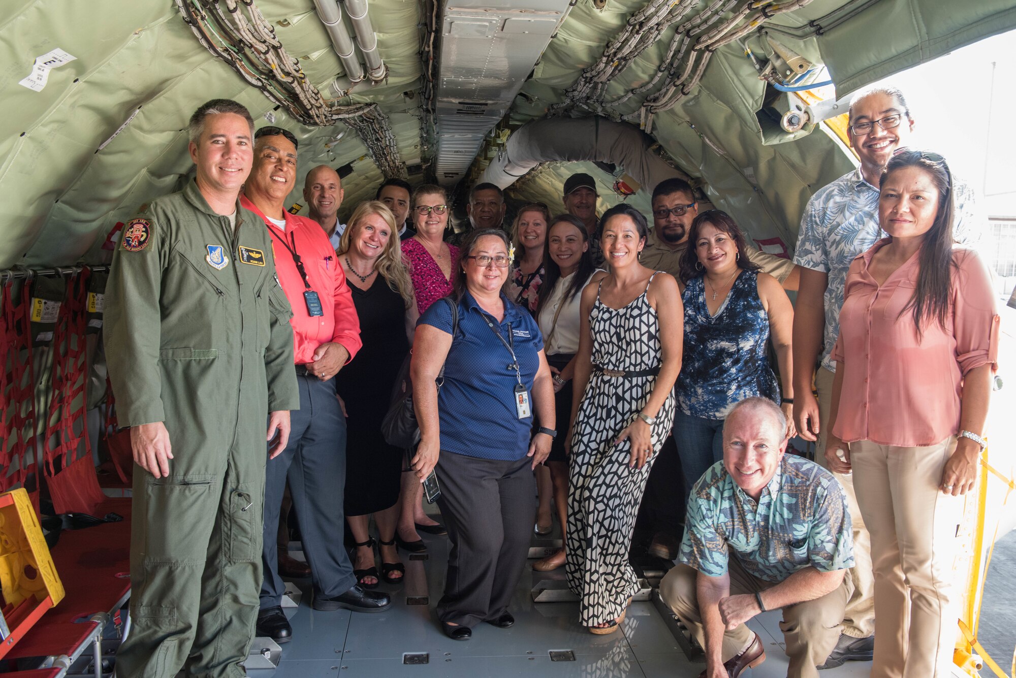A group from the Commonwealth of the Northern Mariana Islands, the Commonwealth Port Authority, and Department of Defense civilians, contractors and service members take a tour of a KC-135R Stratotanker on Joint Base Pearl Harbor-Hickam, Hawaii, Sept. 19, 2018.