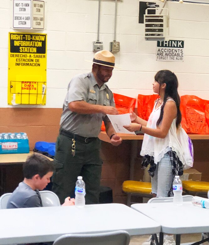 SANTA ROSA LAKE, N.M. – Park Ranger Paul Sanchez presents a certificate of participation to Santa Rosa High School student Anna Lopez, Sept. 22, 2018, for her participation in the National Public Lands Day event at the lake.
