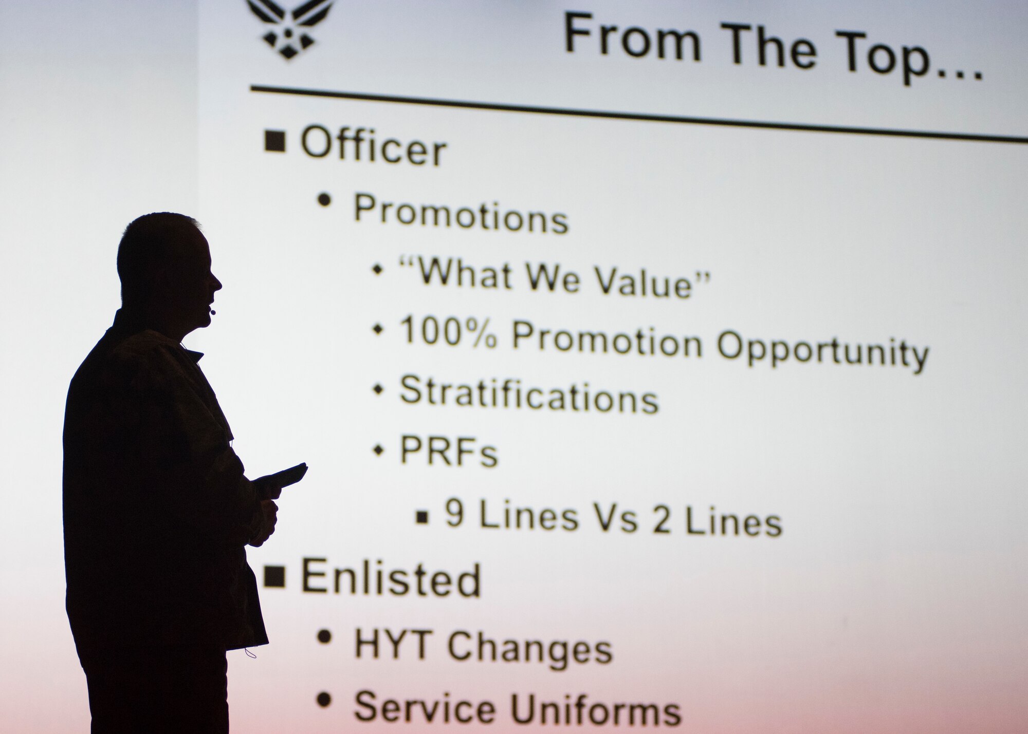 U.S. Air Force Col. Derek Salmi, 92nd Air Refueling Wing commander, uses an interactive presentation to address Airmen during a base all-call at Fairchild Air Force Base, Washington, Sept. 26, 2018. All-calls are often used by senior leadership to address large numbers of base personnel for pressing or widely-applicable topics. (U.S. Air Force photo/Senior Airman Ryan Lackey)