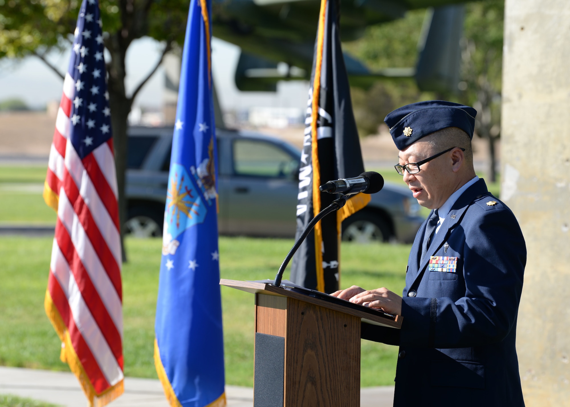 Chaplin (Maj.) Jason Kim, Deputy Wing Chaplin, speaks at the Prisoner of War/Missing in Action ceremony at Freedom Park on Nellis Air Force Base, Nev., Sept. 21, 2018.  Kim commissioned as a chaplain in 2003 so he could help Airmen and their families as they progressed through their Air Force careers. (U.S. Air Force photo by Airman 1st Class Bryan T. Guthrie)