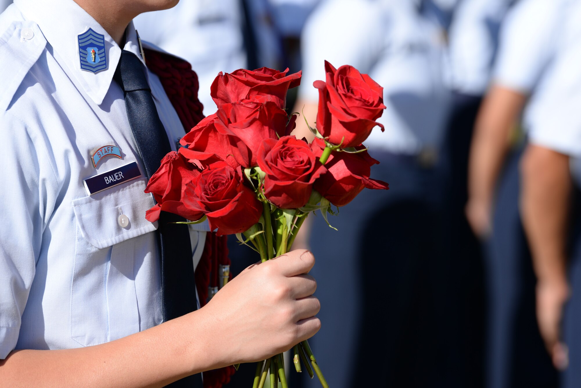 A Junior Reserved Officers’ Training Corps student from Rancho High School holds a bouquet of roses at Freedom Field on Nellis Air Force Base, Nev., Sept. 21, 2018. A red rose symbolizes the blood that one comrade has sacrificed and the hope that family and friends have that one day they will return home.  (U.S. Air Force photo by Airman 1st Class Bryan T. Guthrie)