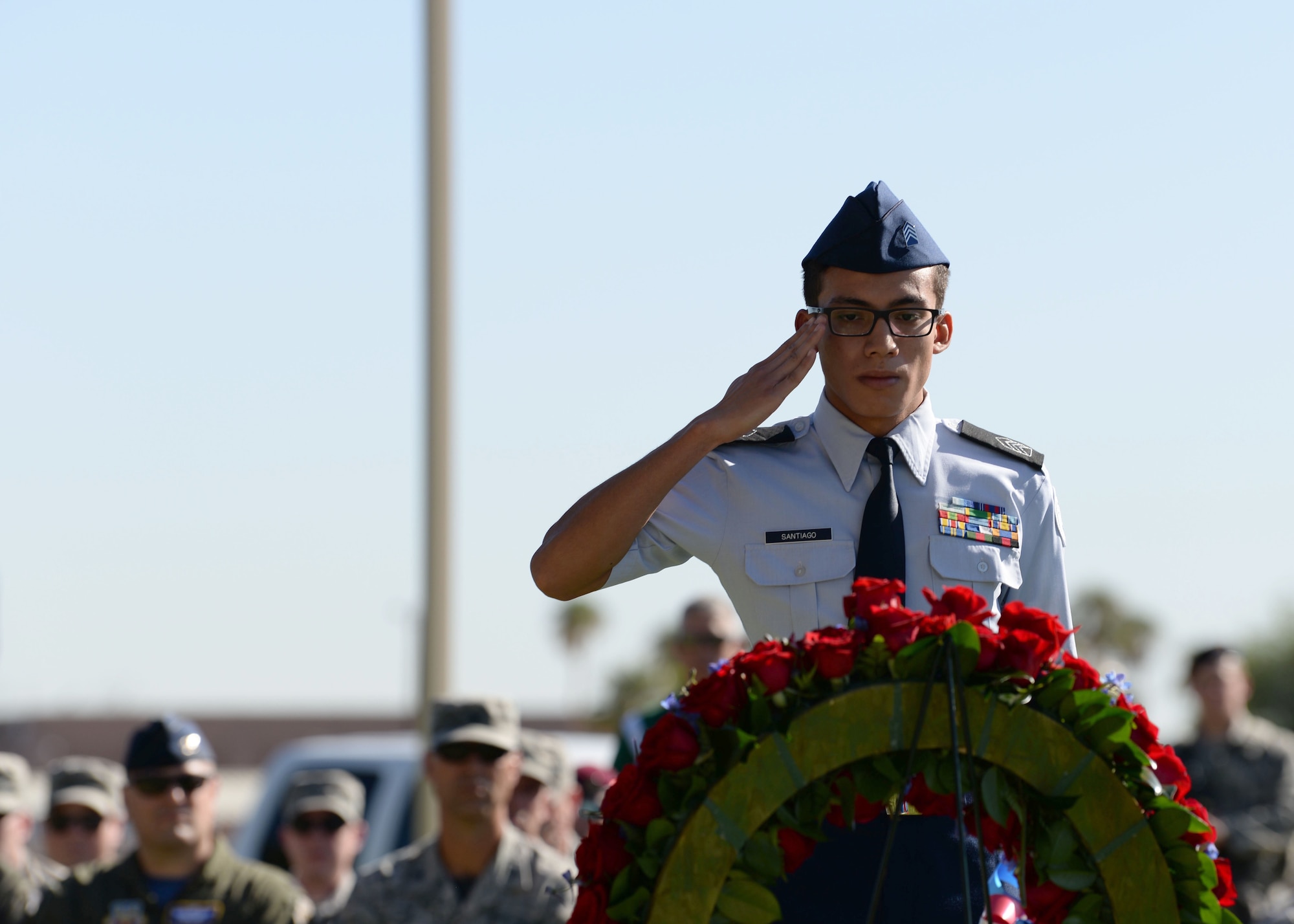 A Reserved Officers’ Training Corps student from Rancho High School salutes the wreath of flowers honoring service members at Freedom Park on Nellis Air Force Base, Nev., Sept. 21, 2018. The Prisoners of War/Missing in Action flag were manufactured for distribution in 1972 after Mrs. Michael Hoff contacted Norman Rivkees from Annin and Company to produce a flag to represent service members that were missing. (U.S. Air Force photo by Airman 1st Class Bryan T. Guthrie)