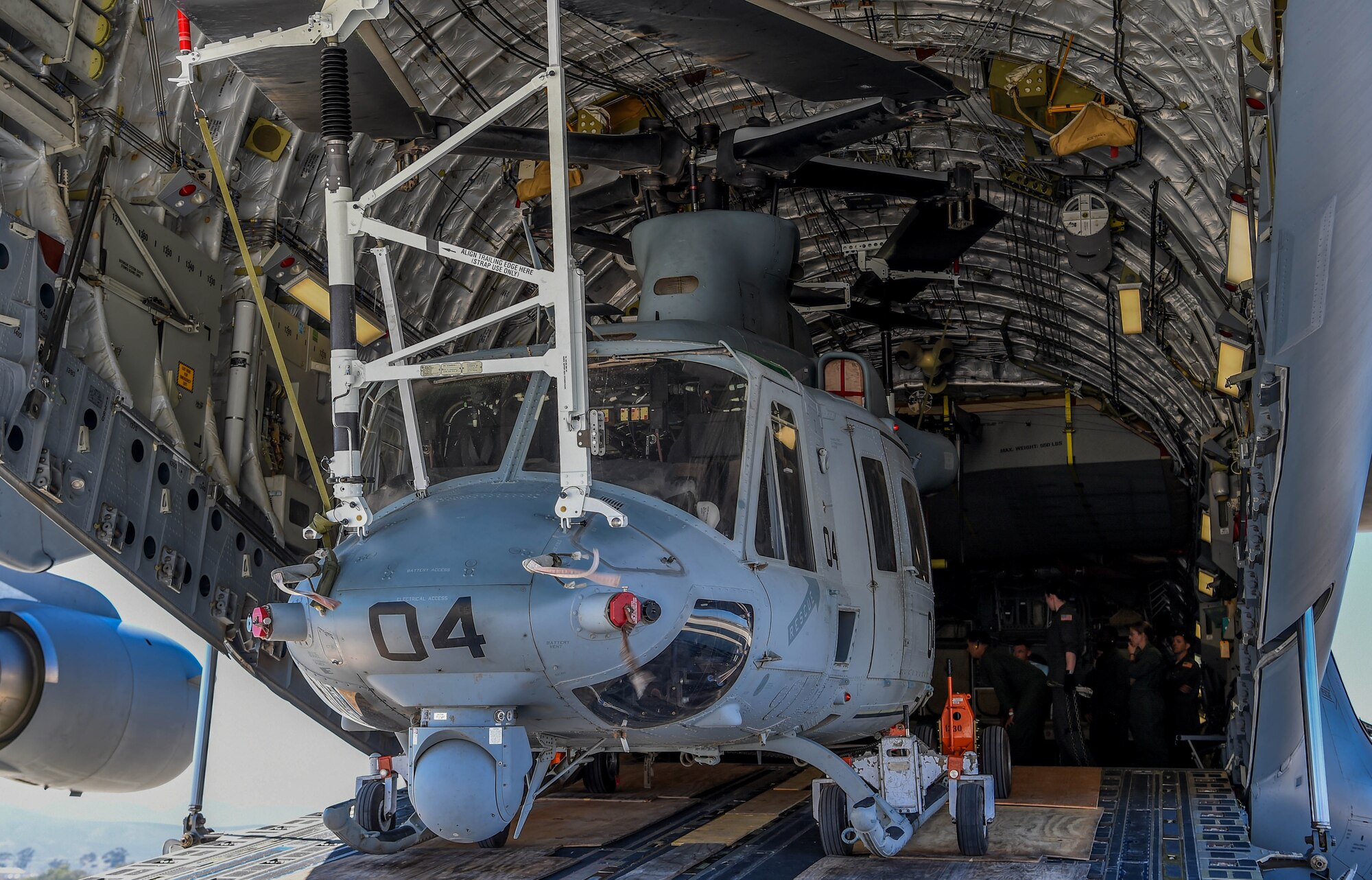 A U.S. Marine Corps UH-1Y Venom sits inside a U.S. Air Force C-17 Globemaster III at Camp Pendleton, Calif., Sept 8, 2018. Airmen from the 4th Airlift Squadron transported the helicopter to the Czech Republic so both aircraft could participate in the NATO Days Air Show held there. (U.S. Air Force photo by Senior Airman Tryphena Mayhugh)