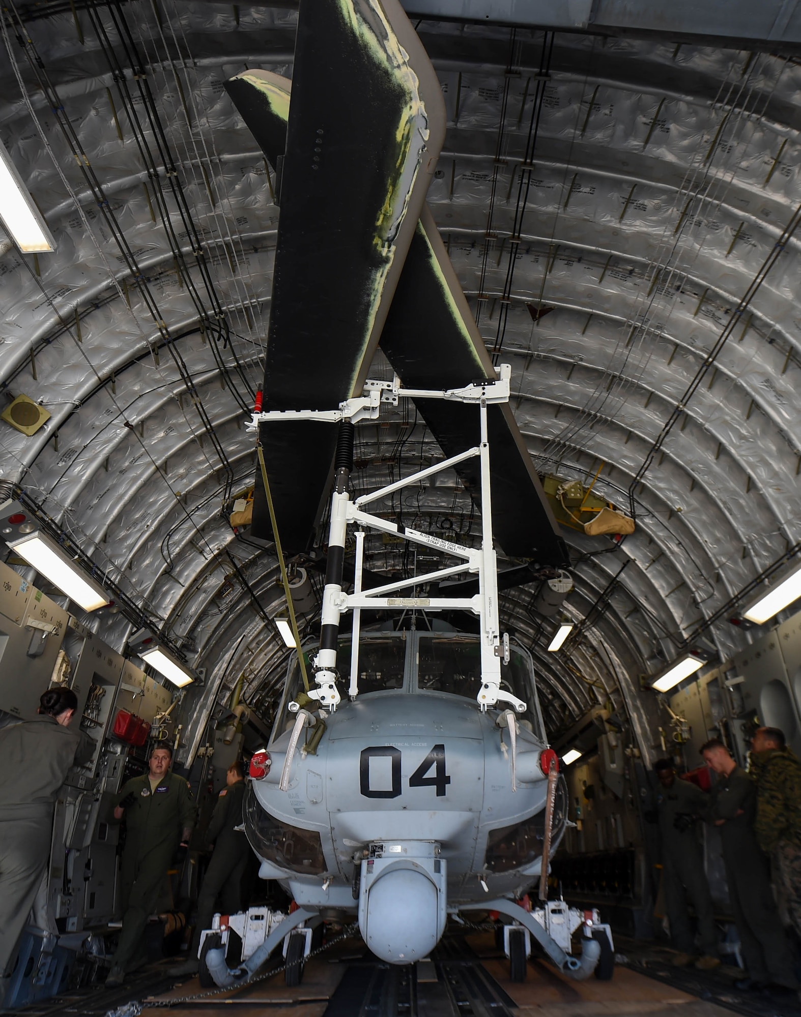 A U.S. Marine Corps UH-1Y Venom sits inside a U.S. Air Force C-17 Globemaster III at Václav Havel Airport Prague, Czech Republic, Sept. 10, 2018. Airmen from the 4th Airlift Squadron transported the helicopter to the Czech Republic so both aircraft could participate in the NATO Days Air Show held there. (U.S. Air Force photo by Senior Airman Tryphena Mayhugh)
