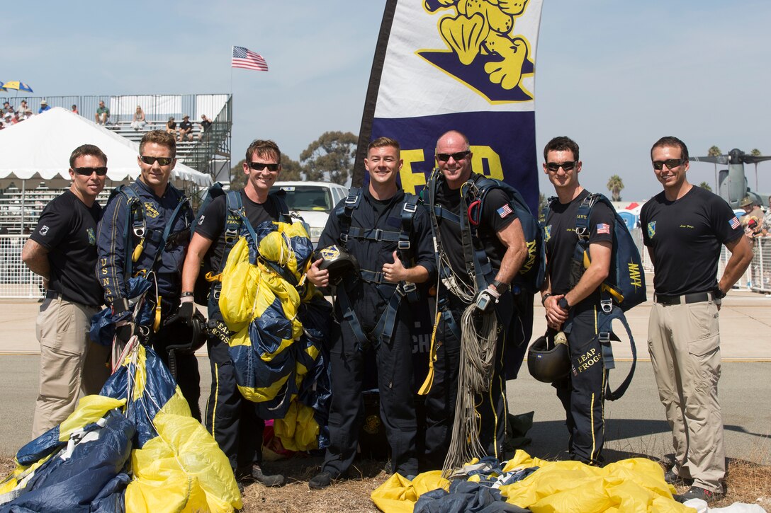 U.S. Navy Parachute Team “Leap Frogs” stand for a group photo during the 2018 Marine Corps Air Station Miramar Air Show at MCAS Miramar, Calif., Sept. 28. This years air show honors “100 years if women in the Marine Corps” by featuring several performances and displays that highlight accomplishments and milestones since the first female enlistee, Opha May Johnson, who joined the service in 1918. (U.S. Marine Corps photo by Lance Cpl. Maritza Vela)