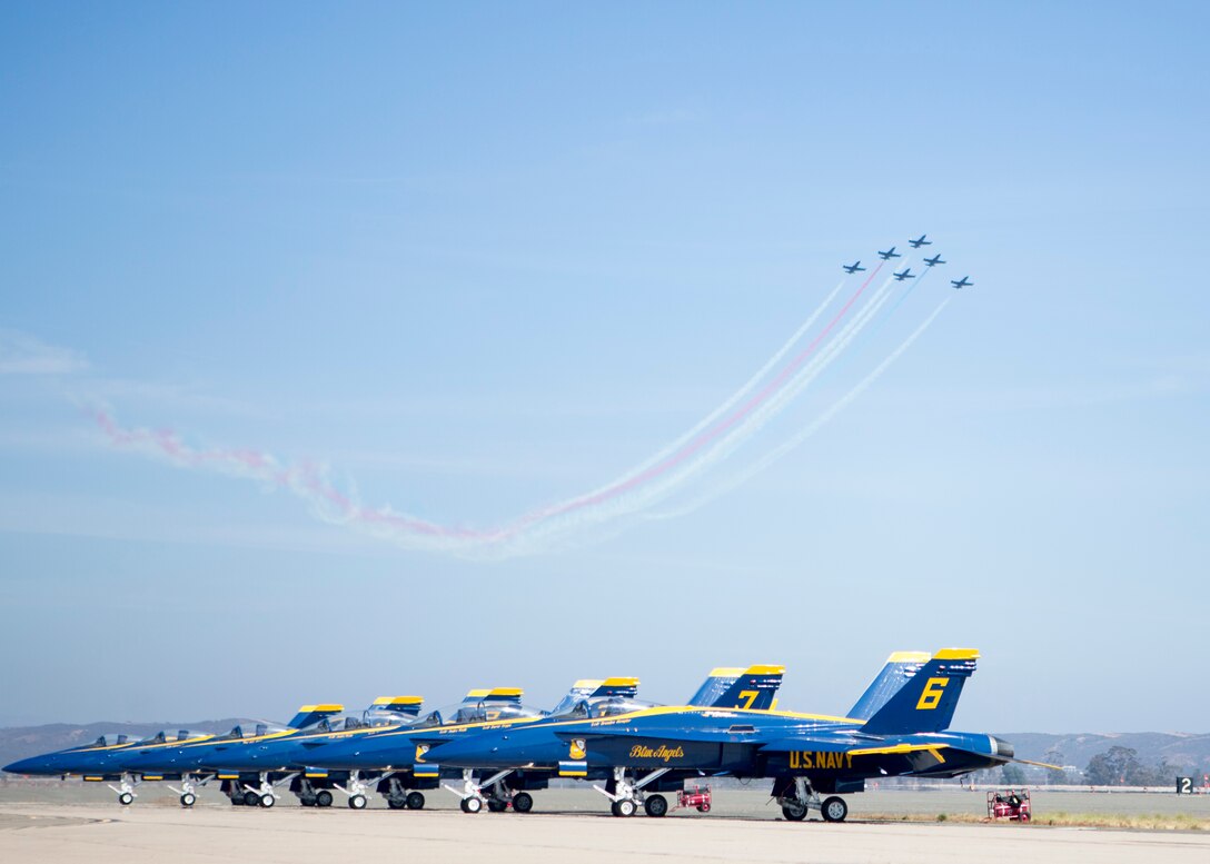 The Patriots Jet Team fly together in formation during their performance in the 2018 Marine Corps Air Station Miramar Air Show at MCAS Miramar, Calif., Sept. 28. This year's air show honors "100 years of women in the Marine Corps" by featuring several performances and displays that highlight the accomplishments and milestones women have made since the first female enlistee, Opha May Johnson, who joined the service in 1918.(U.S. Marine Corps photo by Lance Cpl. Samuel Ruiz)