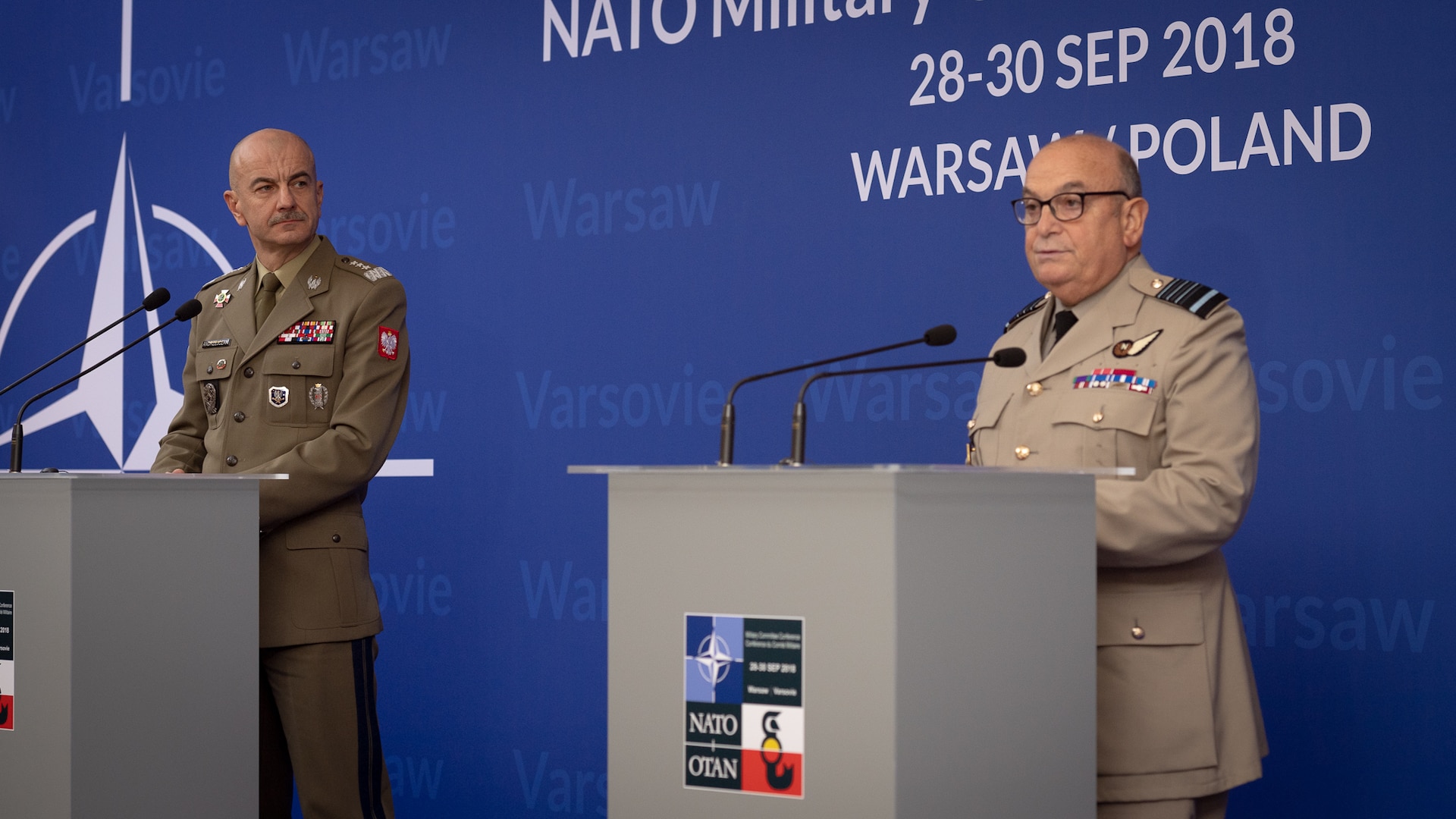 Two NATO officers conduct a news conference.