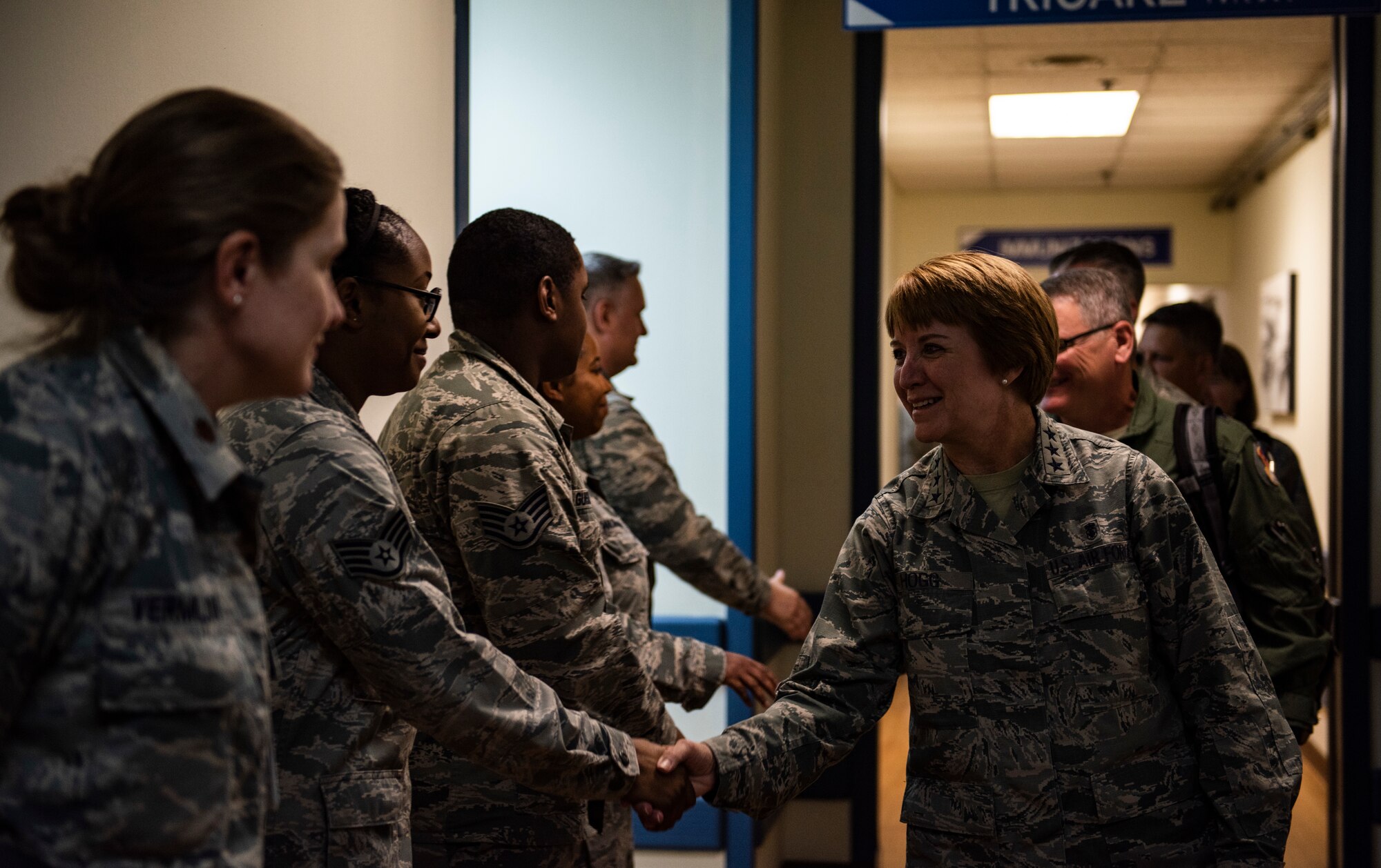 U.S. Air Force Lt. Gen. Dorothy Hogg, Air Force Surgeon General, shakes hands with 8th Medical Group staff during her visit to Kunsan Air Base, Republic of Korea, Sept. 25, 2018. Gen. Hogg toured the 8th MDG to examine their capabilities in support of the 8th Fighter Wing to keep all military members fit to fight, and talk with the Airmen on a personal level. (U.S. Air Force photo by Senior Airman Stefan Alvarez)