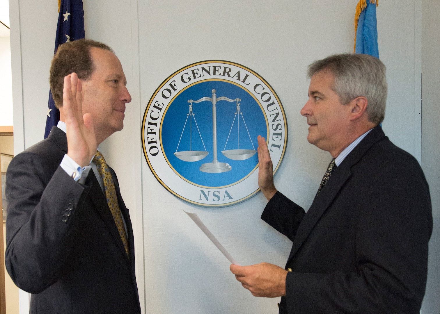 NSA General Counsel Glenn Gerstell receives the oath from Glenn Leuschner Associate Director for Corporate Leadership (l. to r.).