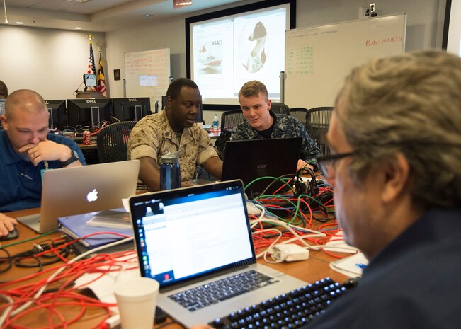 Members of the Red Cell strategize on upcoming opportunities to attempt to degrade the participants' networks.