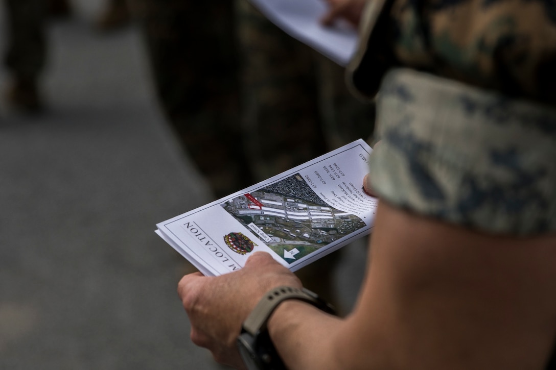 U.S. Marine Corps Col. Joon H. Um, commanding officer of Combat Logistics Regiment 35, 3rd Marine Logistics Group, looks over a pamphlet from Motor Transport Maintenance Company, Maintenance Battalion, during a capabilities tour March 27, 2019 at Camp Kinser, Okinawa, Japan. Senior leaders of 3rd Marine Division came to Camp Kinser to view how CLR-35 supports their Marines on the ground and to learn what logistics capabilities can be utilized by the Marine division. Um is a native of Stamford, Connecticut. (U.S. Marine Corps photo by Cpl. Jamin M. Powell)