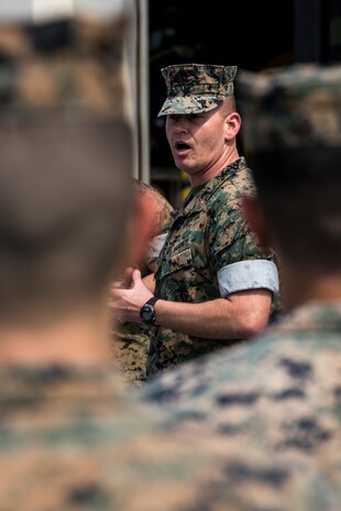 U.S. Marine Corps Chief Warrant Officer 3 William Mckeon, a maintenance officer with Motor Transport Maintenance Company, explains MTM Co.’s capabilities to senior leaders from 3rd Marine Division March 27, 2019. Senior leaders from 3rd MARDIV came to Camp Kinser to view how CLR-35 supports their Marines on the ground and to learn what logistics capabilities can be utilized by the Marine division. Mckeon is a native of Cincinnati, Ohio. (U.S. Marine Corps photo by Cpl. Jamin M. Powell)