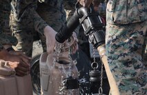 U.S. Marine Corps water support technicians with Combat Logistics Regiment 3 Support Detachment, 3rd Marine Logistics Group, fill water jugs on Iwo To, Japan March 22, 2019. The water support technicians made potable water from ocean water to be used in support of the 74th Reunion of Honor on Iwo To. More than 150 Marines and Sailors from III Marine Expeditionary Force and major subordinate commands make up the detachment tasked with all administrative and logistical support. (U.S. Marine Corps photo by Lance Cpl. Armando Elizalde)