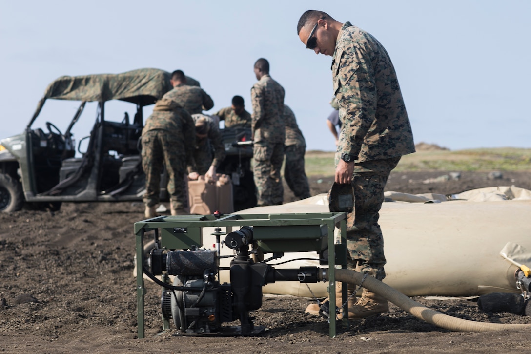 U.S. Marine Corps Lance Cpl. Jose A. Toledovieyra, a water support technician with Combat Logistics Regiment 3 Support Detachment, 3rd Marine Logistics Group, monitors a water pump on Iwo To, Japan March 22, 2019. The water support technicians made potable water from ocean water to be used in support of the 74th Reunion of Honor on Iwo To. More than 150 Marines and Sailors from III Marine Expeditionary Force and major subordinate commands make up the detachment tasked with all administrative and logistical support. Toledovieyra is a native of Fairfield, California. (U.S. Marine Corps photo by Lance Cpl. Armando Elizalde)