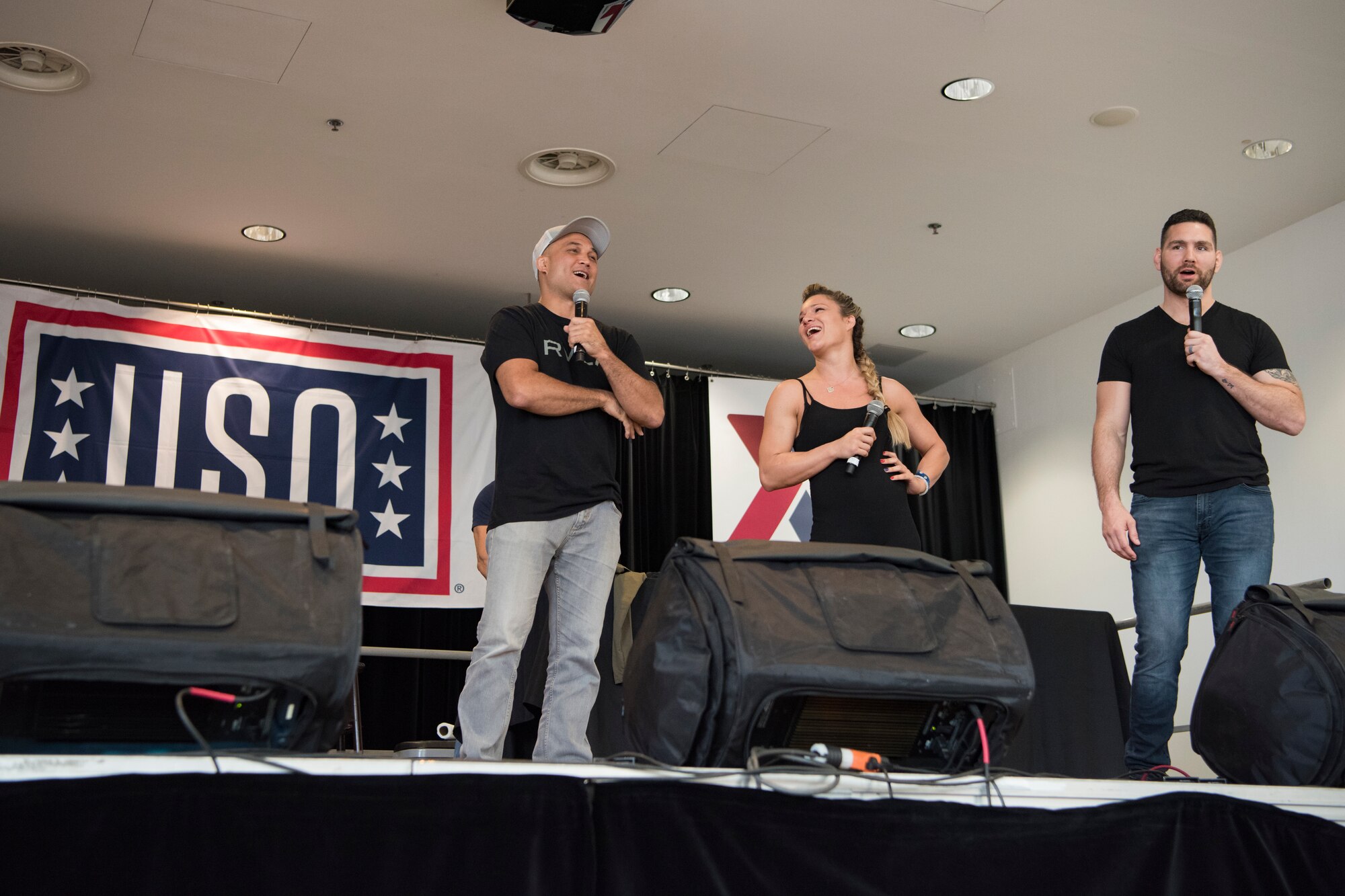 (From left) BJ Penn, former Ultimate Fighting Championship Lightweight and Welterweight Champion, Felice Herrig, UFC fighter, and Chris Weidman, former UFC Middleweight Champion laugh, joke, and answer questions from members of the audience on Ramstein Air Base, Germany, March 30, 2019.