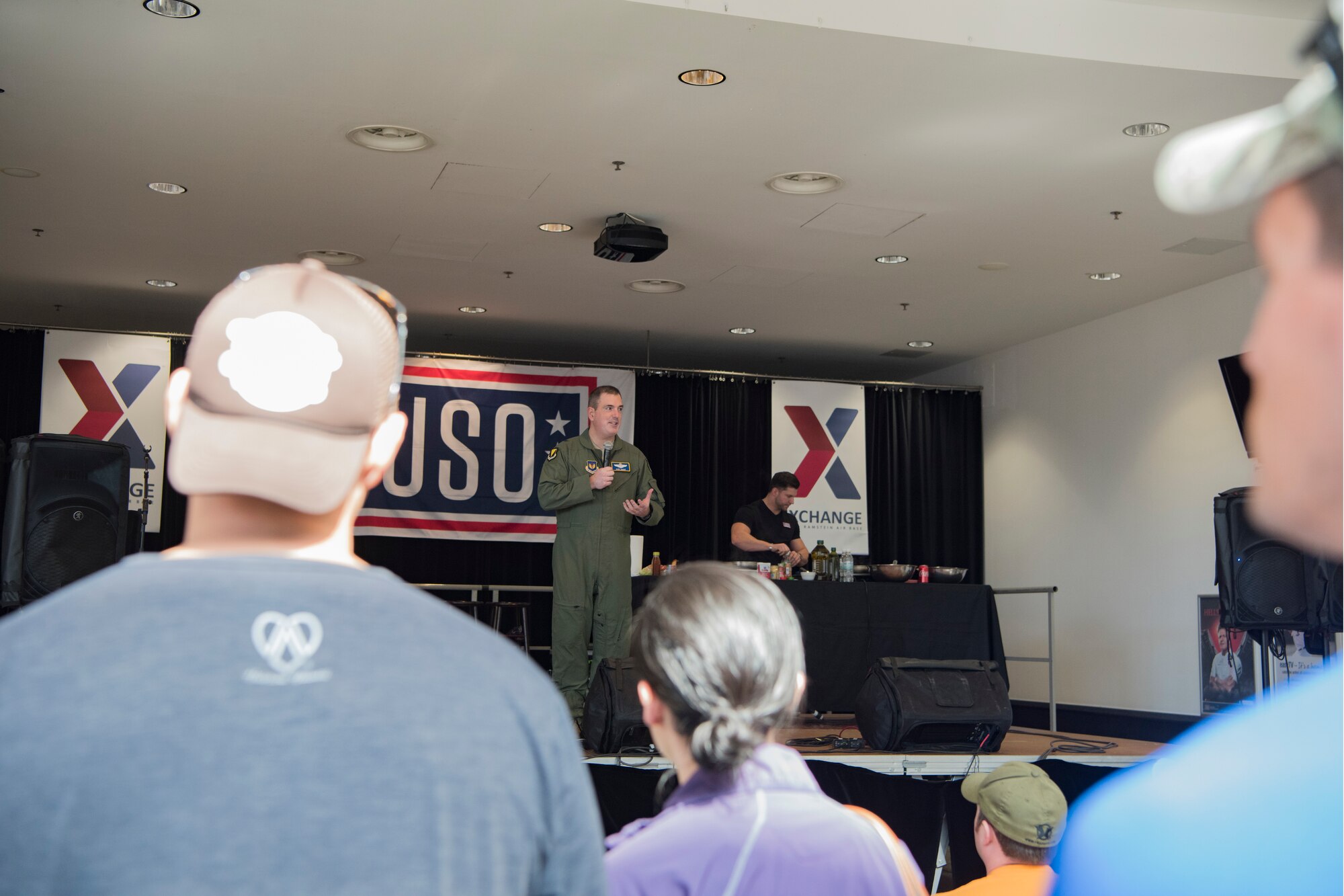 U.S. Air Force Brig. Gen. Mark August, 86th Airlift Wing commander introduces U.S. Air Force Gen. Paul Selva, Joint Chiefs of Staff vice chairman, and seven celebrities during a USO Spring Visit on Ramstein Air Base, Germany, March 30, 2019.
