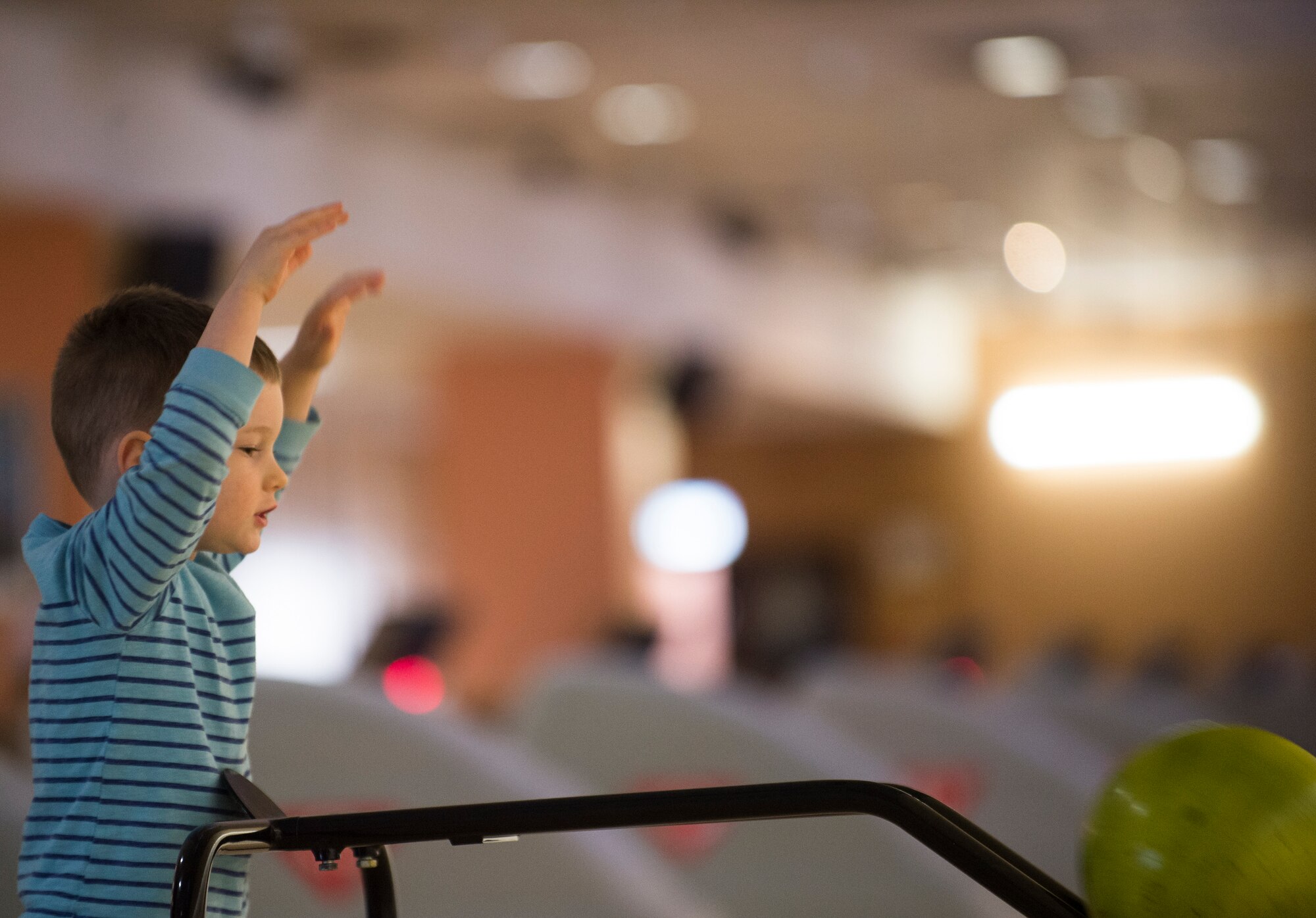 A Team Ramstein child watches his bowling ball roll during the Deployed Family Dinner at the Vogelweh Bowling Alley on Vogelweh Military Complex, Germany, March 28, 2019. The Deployed Family Dinners are an opportunity to get kids out of the house, do something fun, and make connections with the 86th Force Support Squadron Airman and Family Readiness Center staff and volunteers who support these events. (U.S. Air Force photo by Staff Sgt. Jonathan Bass)
