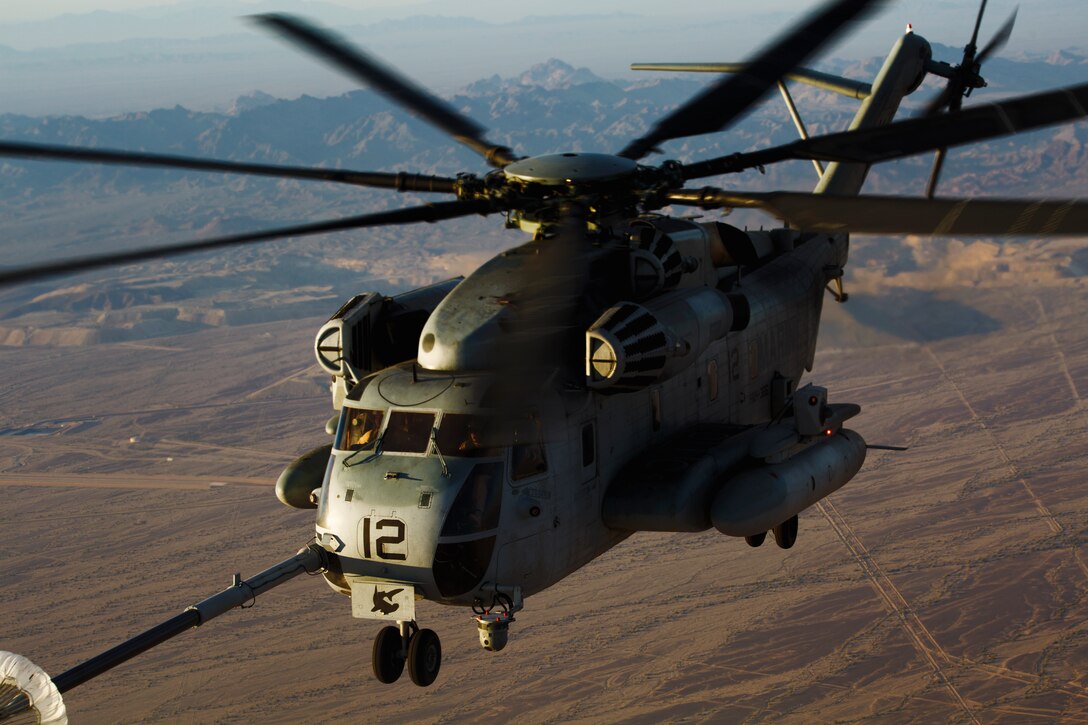 A U.S. Marine Corps CH-53E Super Stallion aircraft assigned to Marine Aviation Weapons and Tactics Squadron One performs a high altitude aerial refuel in support of Weapons and Tactics Instructor course 2-19 in Yuma, Arizona, March 27, 2019. WTI is a seven-week training event hosted by MAWTS-1, which emphasizes operational integration of the six functions of Marine Corps aviation in support of a Marine Air Ground Task Force. WTI also provides standardized advanced tactical training and certification of unit instructor qualifications to support Marine aviation training readiness and assists in developing and employing aviation weapons and tactics.