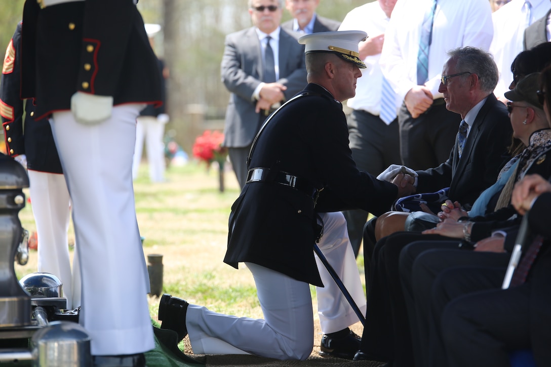 Lt. Col. Scott Clippinger with Marine Barracks Washington D.C., speaks with family member during a full honors funeral for retired Marine Lt. Col. Howard V. Lee, Medal of Honor recipient, at Colonial Grove Memorial Park, Virginia Beach, Virginia, March 30, 2019.