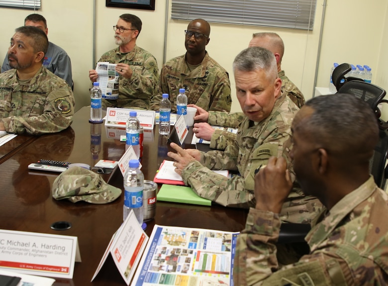 LTG Todd T. Semonite engages in a conversation with Afghanistan District Commander Jason Kelly during his visit in theater, while others in the district overview meeting look on.