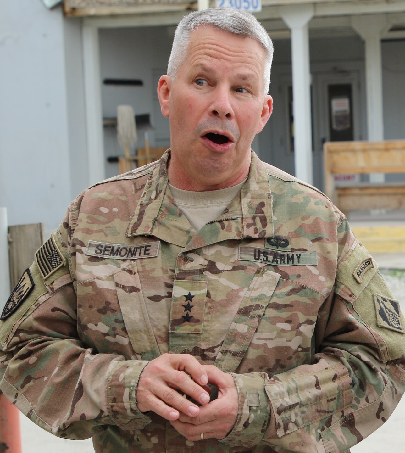LTG Todd T. Semonite, USACE Chief of Engineers speaks to the Afghanistan District team members following a group photo in front of the iconic District T-Wall.