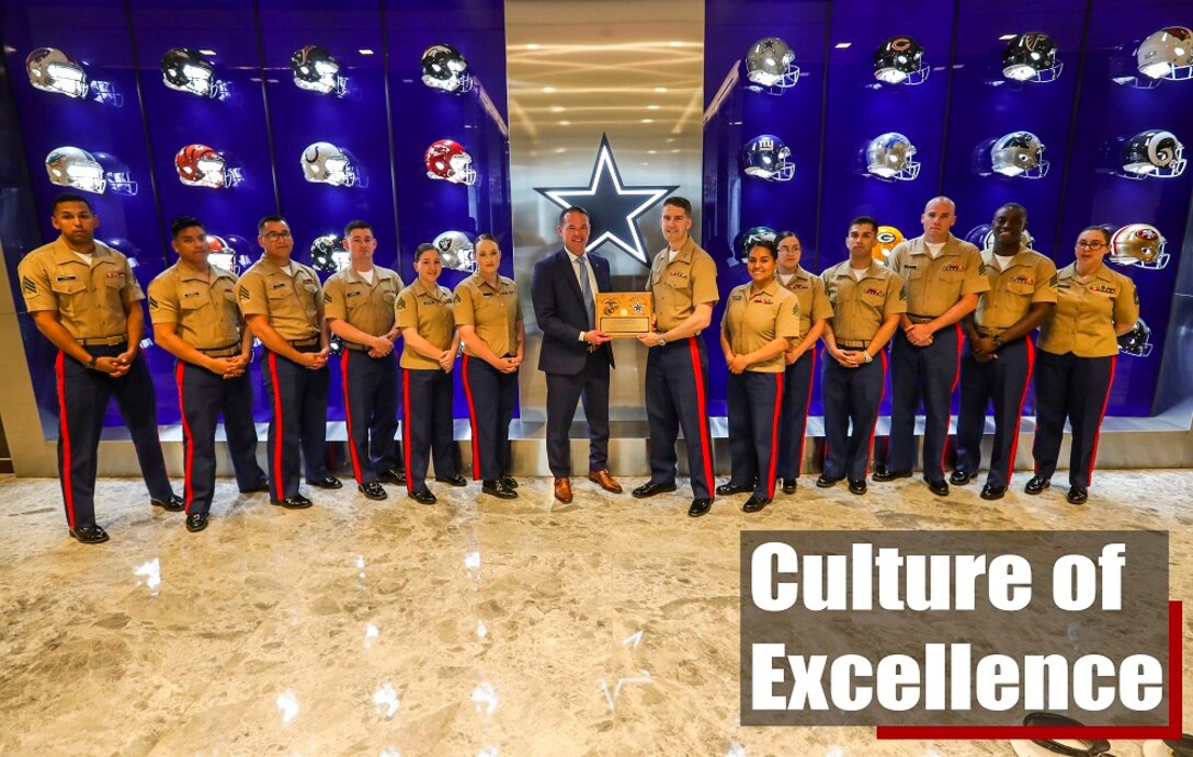 The marketing and communications Marines from the 8th Marine Corps District presented Matt McInnis, the director of corporate partnership sales for the Dallas Cowboys, a plaque in appreciation for the support and training provided during a tour of the Star in Frisco, Texas. The tour was part of the 2019 8MCD MAC training conference which occurred from March 25-29, 2019 in Fort Worth, Texas.