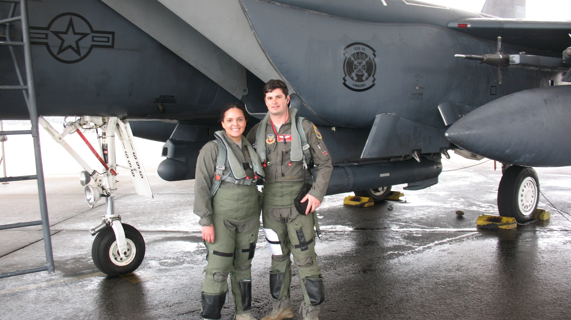 Senior Airman McKayla Dejohnette, 26th Operational Weather Squadron (OWS) weather forecaster, and Capt. Jon Koritz, a 333rd Fighter Squadron F-15E pilot, stand in front of an F-15E Strike Eagle aircraft at Seymour Johnson Air Force Base, North Carolina, Feb. 21, 2019. Dejohnette was one of two 26th OWS Airmen to receive a familiarization flight aboard two F-15E Strike Eagles to see firsthand how their weather products affect the fighters’ mission. (Courtesy photo)