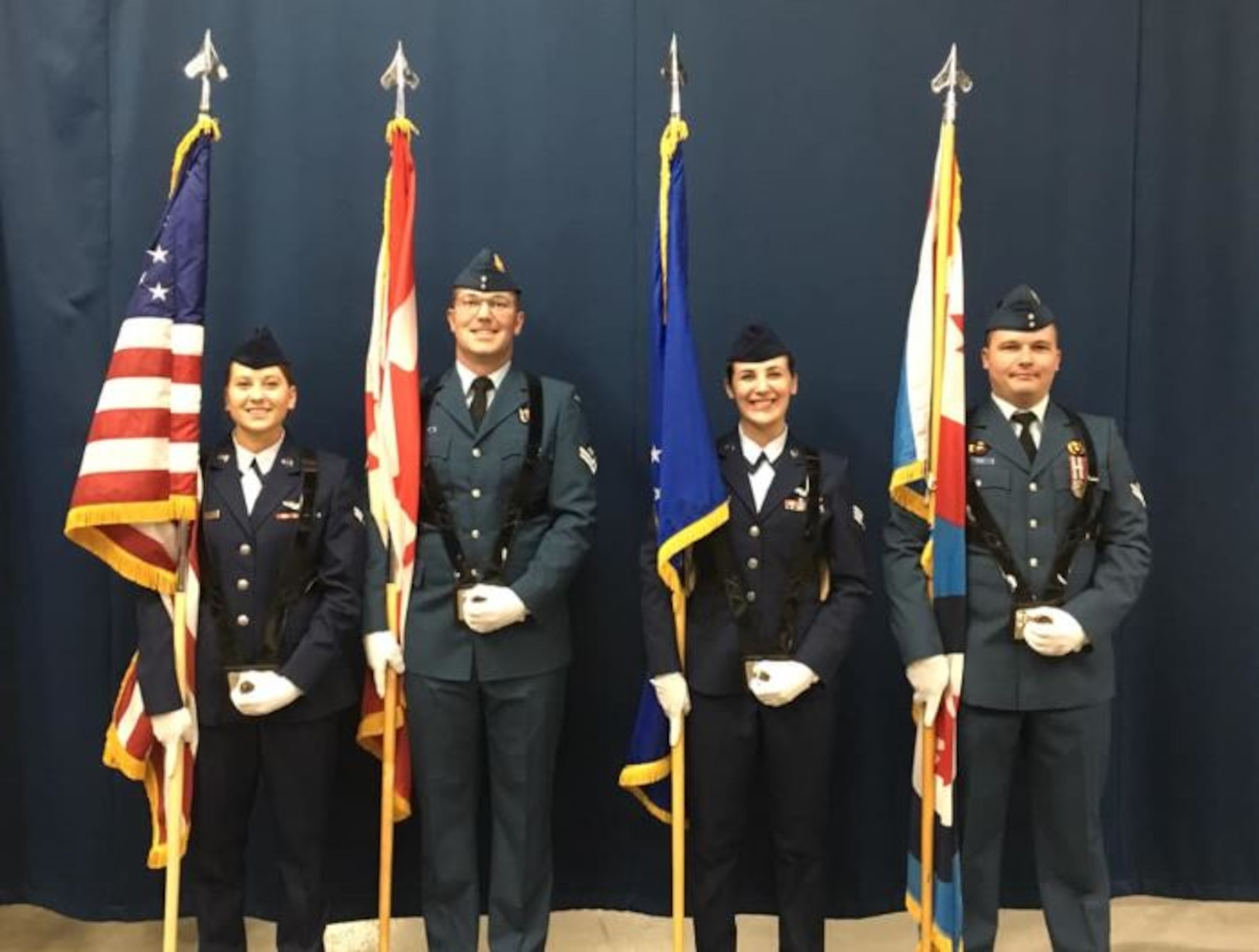 Members of the Canadian Detachment and the 552nd Air Control Wing present the colors at the Oklahoma City Thunder basketball game March 20, as the Toronto Raptors were the visiting team. From left, Airman 1st Class Melissa Rosenthal, 552nd ACW; Master Cpl. Francis Roller, Canadian Detachment; Senior Airman Ashley Lopez, 552nd ACW and Master Cpl. Brandon Rice, Canadian Detachment.
