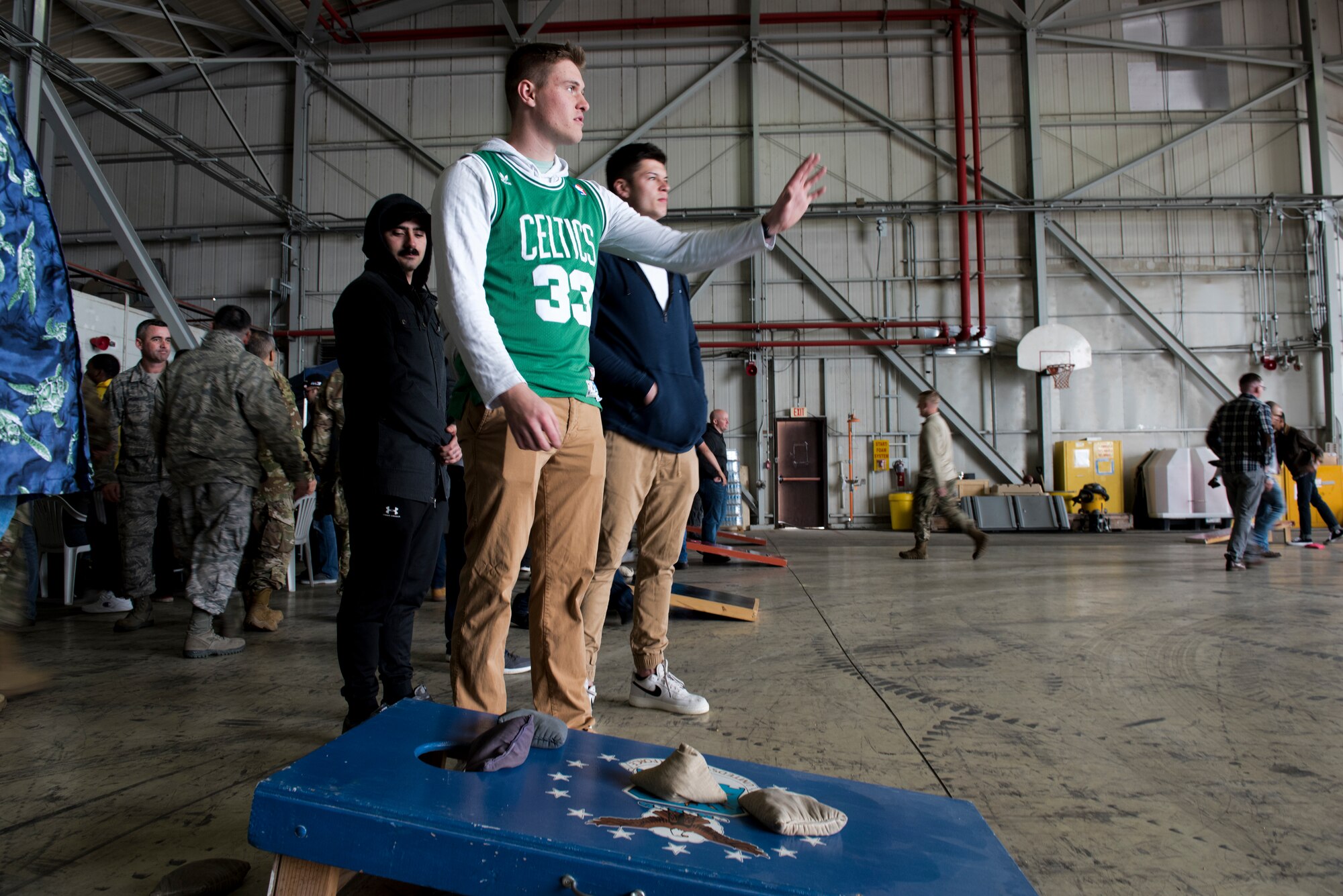 Airmen of Incirlik Air Base play corn hole in a hangar March 29, 2019, at Incirlik Air Base, Turkey.