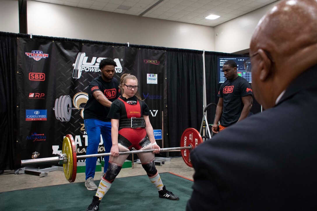 A competitor in the USA Powerlifting National High School Championship completes a lift March 28, 2019 in Alexandria, Louisiana.  The Air Force Reserve helped sponsor the event and recruiters from the 307th Bomb Wing were on hand to represent the unit.  (U.S. Air Force photo by Master Sgt. Ted Daigle)