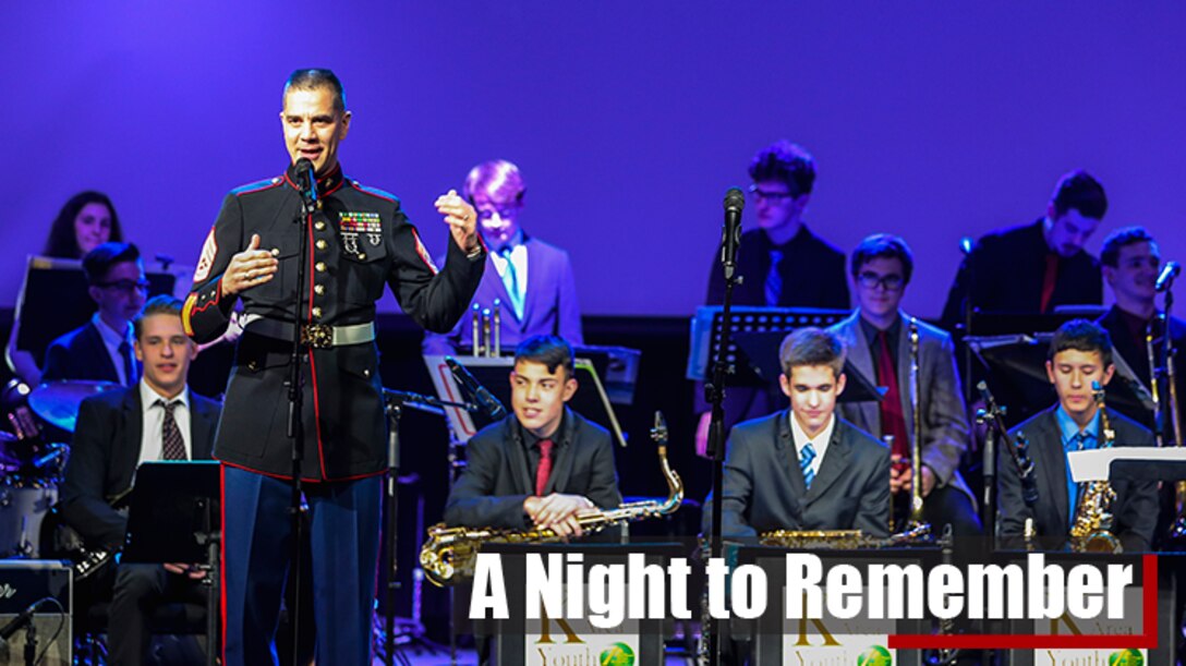 U.S. Marine Corps Gunnery Sgt. Ken Ebo, a musical technical assistant for the 8th Marine Corps district performs alongside a high school musician from the Keller school district.