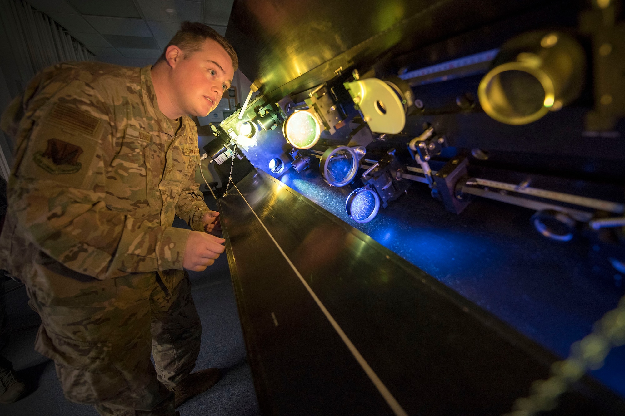 Senior Airman Sidney Johnson, 2d Weather Squadron, Detachment 4, solar analyst, focuses telescope lenses, March 19, 2019, on Holloman Air Force Base, N.M. Analysts are given two minutes to report routine or event solar findings to to geophysical and solar activity forecasters who then push additional findings within six minutes to DoD space weather users, such as Air Force Space Command, Joint Space Operations Center, NORAD, and Joint Force, and in addition, to civilian customers such as NASA and the Federal Aviation Administration. (U.S. Air Force photo by Staff Sgt. Christine Groening)