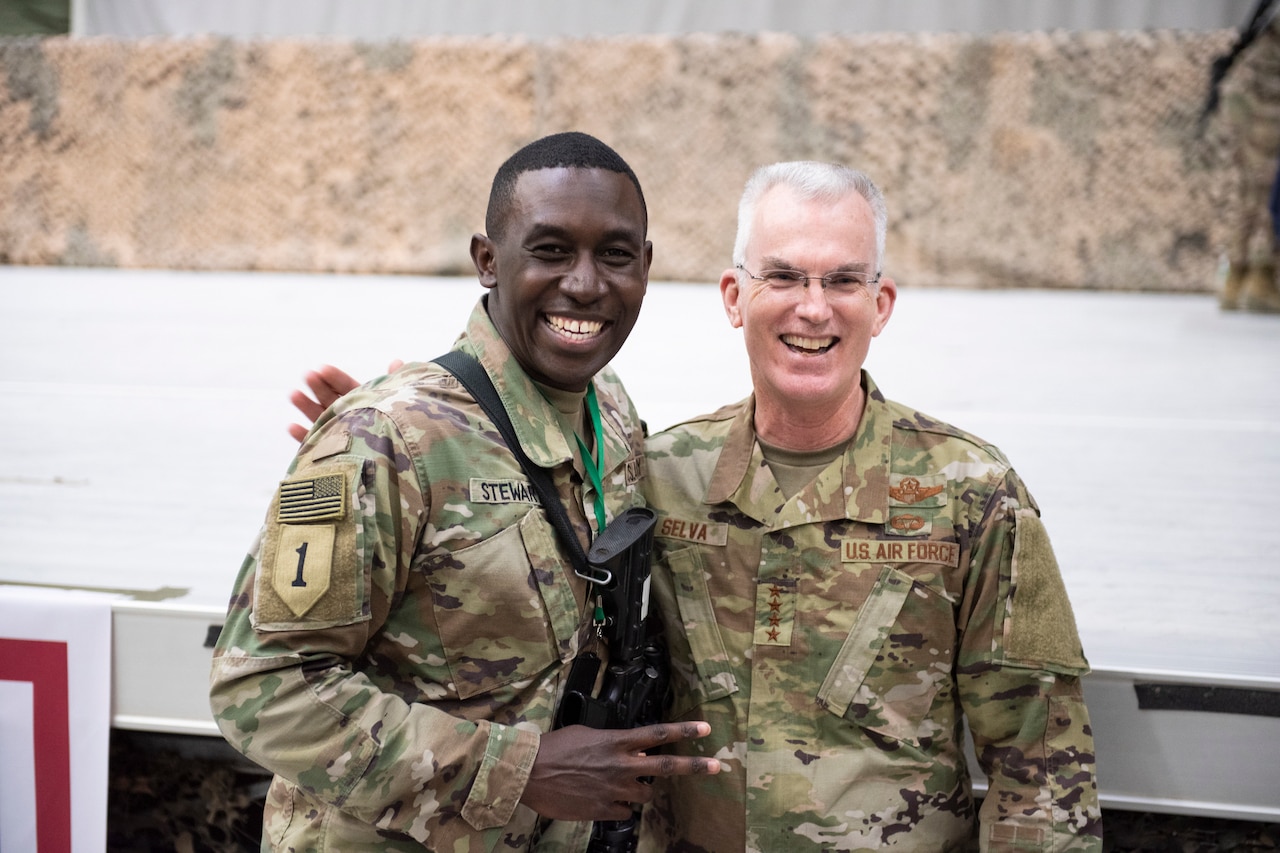 Air Force Gen. Paul J. Selva, vice chairman of the Joint Chiefs of Staff, stands next to a man while posing for a photo.