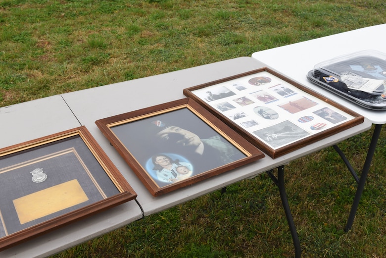 A display is arranged in memory of Sgt. Gerald Fritz during the Fritz Military Working Dog Kennel unveiling on Goodfellow Air Force Base, Texas, March 29, 2019. Photos and albums provided by the family, along with awards lined the tables of the display. (U.S. Air Force photo by Airman 1st Class Zachary Chapman/Released)