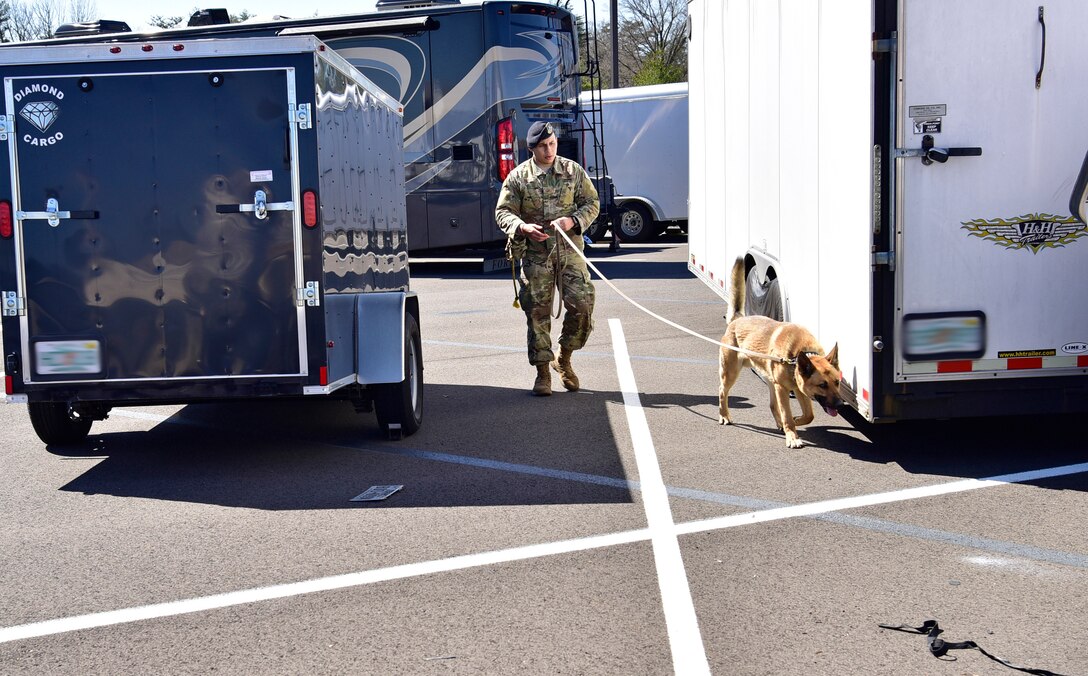 Senior Airman Nathan White, 11th Security Support Squadron military working dog handler, performs validation training with his dog, Toro, on Joint Base Andrews, Md., March 26, 2019. Every six months, handlers are tested on validation training to ensure the duo is working effectively. (U.S. Air Force photo by Airman 1st Class Noah Sudolcan)
