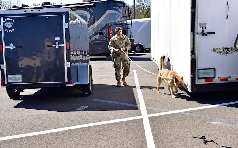 Senior Airman Nathan White, 11th Security Support Squadron military working dog handler, performs validation training with his dog, Toro, on Joint Base Andrews, Md., March 26, 2019. Every six months, handlers are tested on validation training to ensure the duo is working effectively. (U.S. Air Force photo by Airman 1st Class Noah Sudolcan)