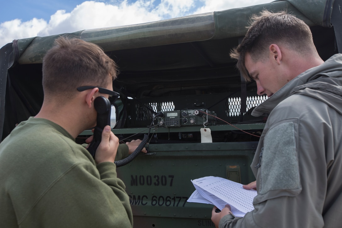Cpl. Devin Stanford, left, and Cpl. James Barrett, field radio operators with Marine Wing Communications Squadron 38, Marine Air Control Group 38, 3rd Marine Aircraft Wing, compete in the sixth annual low power high frequency (HF) communications competition (QRPX) at Marine Corps Air Station Miramar, Calif., March 22, 2019. The QRPX allows personnel to train on basic HF radio procedures and test their HF radio equipment and antennas during a no-threat, competitive environment. (U.S. Marine Corps photo by Lance Cpl. Julian Elliott-Drouin)