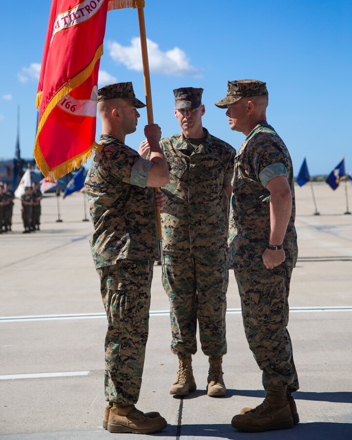 Marine Sgt. Maj. Garett G. Kirkby, sergeant major of Marine Medium Tiltrotor Squadron (VMM) 166, Marine Aircraft Group (MAG) 16, 3rd Marine Aircraft Wing (MAW), salutes the passing of the colors from Lt. Col Charles E. Bodwell, VMM-166, MAG-16, 3rd MAW to Lt. Col. James C. Ford III, commanding officer of VMM-166, MAG-16, 3rd MAW, during a change of command ceremony at Marine Corps Air Station Miramar, Calif., March 28, 2019. The passing of the colors from Bodwell to Ford signifies the transfer of responsibility, authority and accountability from the outgoing commanding officer to the incoming commanding officer. (U.S. Marine Corps photo by Cpl. Samuel Ruiz)