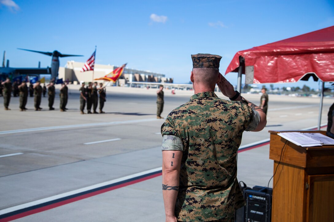 Marine Sgt. Maj. Garett G. Kirkby, sergeant major of Marine Medium Tiltrotor Squadron 166, Marine Aircraft Group 16, 3rd Marine Aircraft Wing, salutes during the playing of the national anthem during a change of command ceremony the squadron at Marine Corps Air Station Miramar, Calif., March 28, 2019. The passing of the colors from Lt. Col. Charles E. Bodwell to Lt. Col. James C. Ford III signifies the transfer of responsibility, authority and accountability from the outgoing commanding officer to the incoming commanding officer. (U.S. Marine Corps photo by Cpl. Samuel Ruiz)