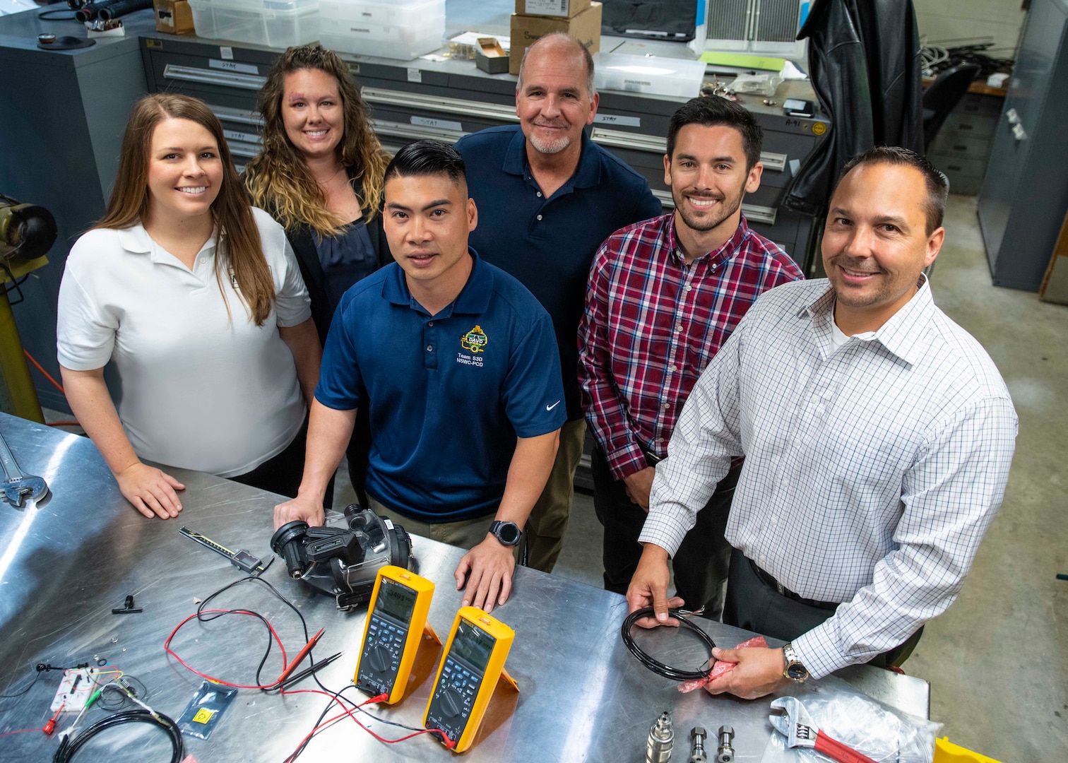 PANAMA CITY, Florida - The LED Air Warning System team from Naval Surface Warfare Center Panama City Division, in collaboration with local academia and an industry partner, has been selected by the Federal Laboratory Consortium to receive one of its highest honors – a 2019 Excellence in Technology Transfer. Award. Pictured from left to right: Paige George, Allie Williams, Tien Le, Dennis Gallagher, Hayden DeForge, and Brian Wentworth. U.S. Navy phoot by Eddie Green