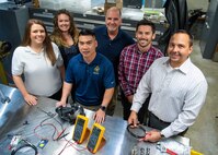 PANAMA CITY, Florida - The LED Air Warning System team from Naval Surface Warfare Center Panama City Division, in collaboration with local academia and an industry partner, has been selected by the Federal Laboratory Consortium to receive one of its highest honors – a 2019 Excellence in Technology Transfer. Award. Pictured from left to right: Paige George, Allie Williams, Tien Le, Dennis Gallagher, Hayden DeForge, and Brian Wentworth. U.S. Navy phoot by Eddie Green