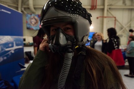 Madilyn Heater, Wando High School student, dons a pilot uniform and helmet during a career day event March 19, 2019, at Joint Base Charleston, S.C.