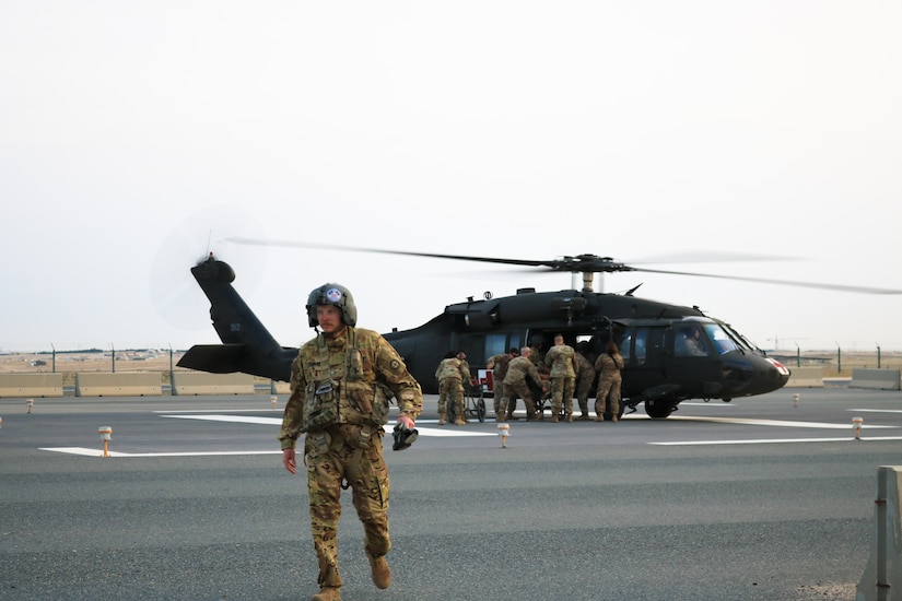 Soldier exits the helipad during the Golden Trident mass casualty training exercise at Camp Arifjan, Kuwait, March 21, 2019.