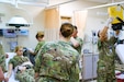 U.S. Army Soldiers assigned to the 452d Combat Support Hospital provide medical care during the Golden Trident mass casualty training exercise at Camp Arifjan, Kuwait, March 21, 2019.