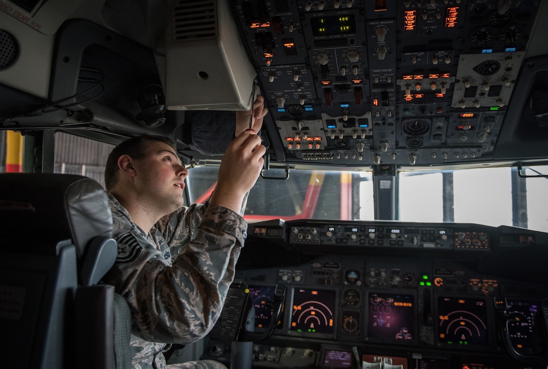 Tech. Sgt. Anthony Finocchiaro, electronic integrated systems mechanic, 932nd Maintenance Group, tightens a screw after servicing the Head-Up Display (HUD) for a C-40C Mar. 28, 2019, Scott Air Force Base, Illinois. Each of the four C-40C aircraft, stationed at Scott AFB, undergo routine inspections ensuring safe flights for the executive airlift missions supporting of our nation’s leaders. (U.S. Air Force photo by Christopher Parr)