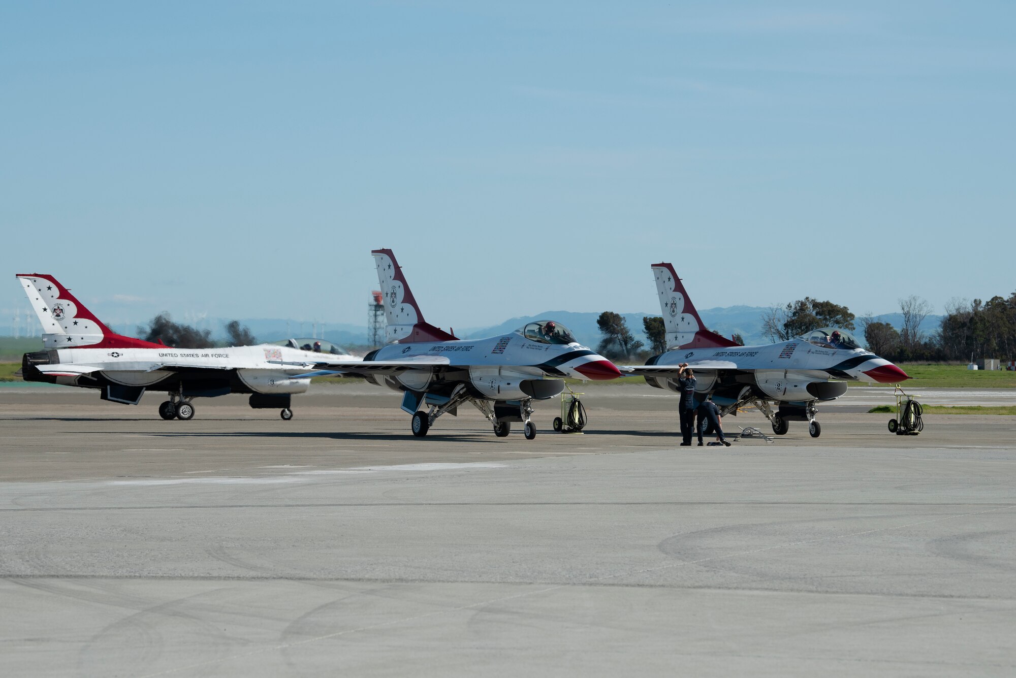 The U.S. Air Force Thunderbirds aerial demonstration team taxi to their parking spots after performing at the Thunder Over the Bay air show March 30, 2019 at Travis Air Force Base, Calif. The show also featured the F-22 Raptor and the U.S. Army Golden Knights, along with 40 static displays. The event honored hometown heroes like police officers, firefighters, nurses, teachers and ordinary citizens whose selfless work made their communities safer and enhanced the quality of life. (U.S. Air Force photo by Tech. Sgt. James Hodgman)